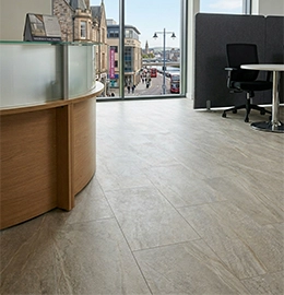 A professional Inverness office reception area featuring newly installed stone effect HydroLuxe LVT flooring from Ness Blinds & Floors